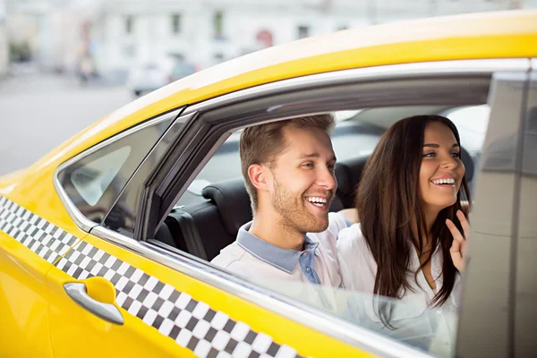 depositphotos_110892424-stock-photo-smiling-people-in-a-taxi